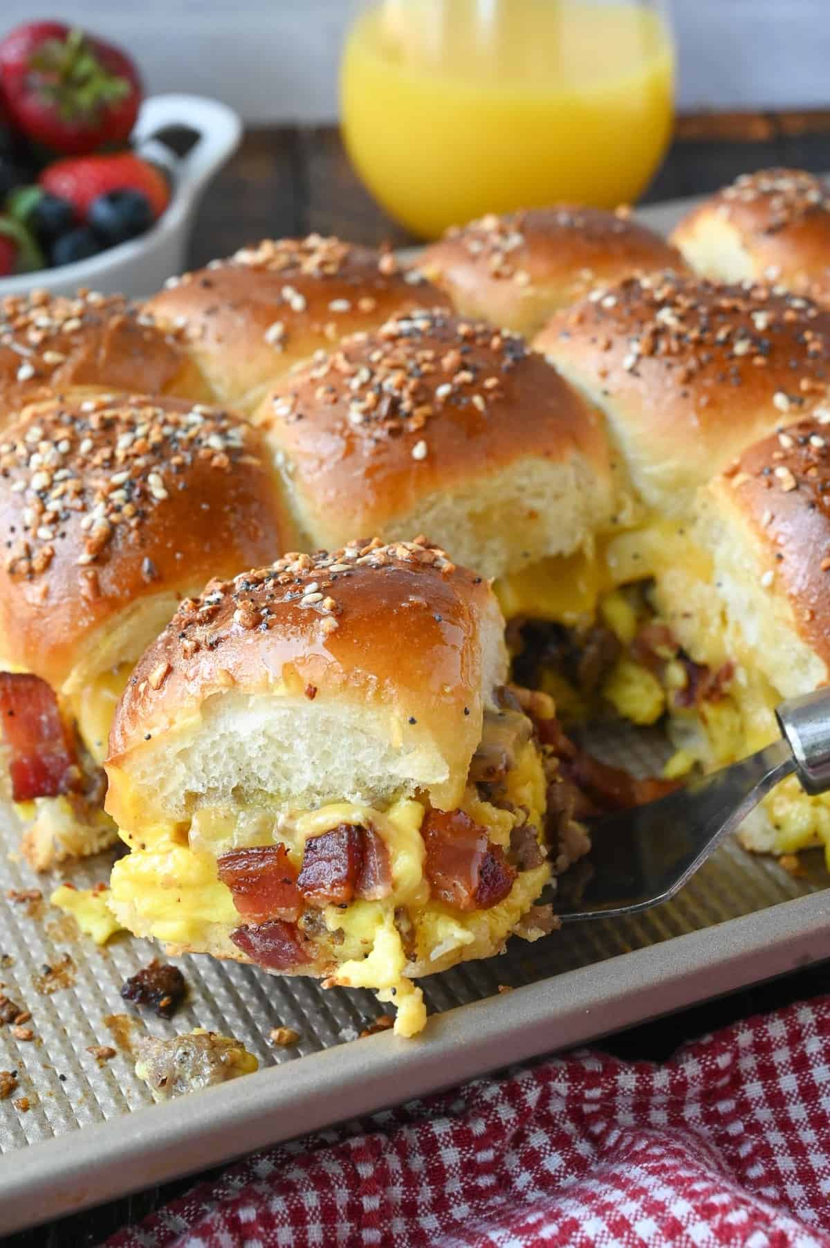 Breakfast slider being picked up with a spatula.