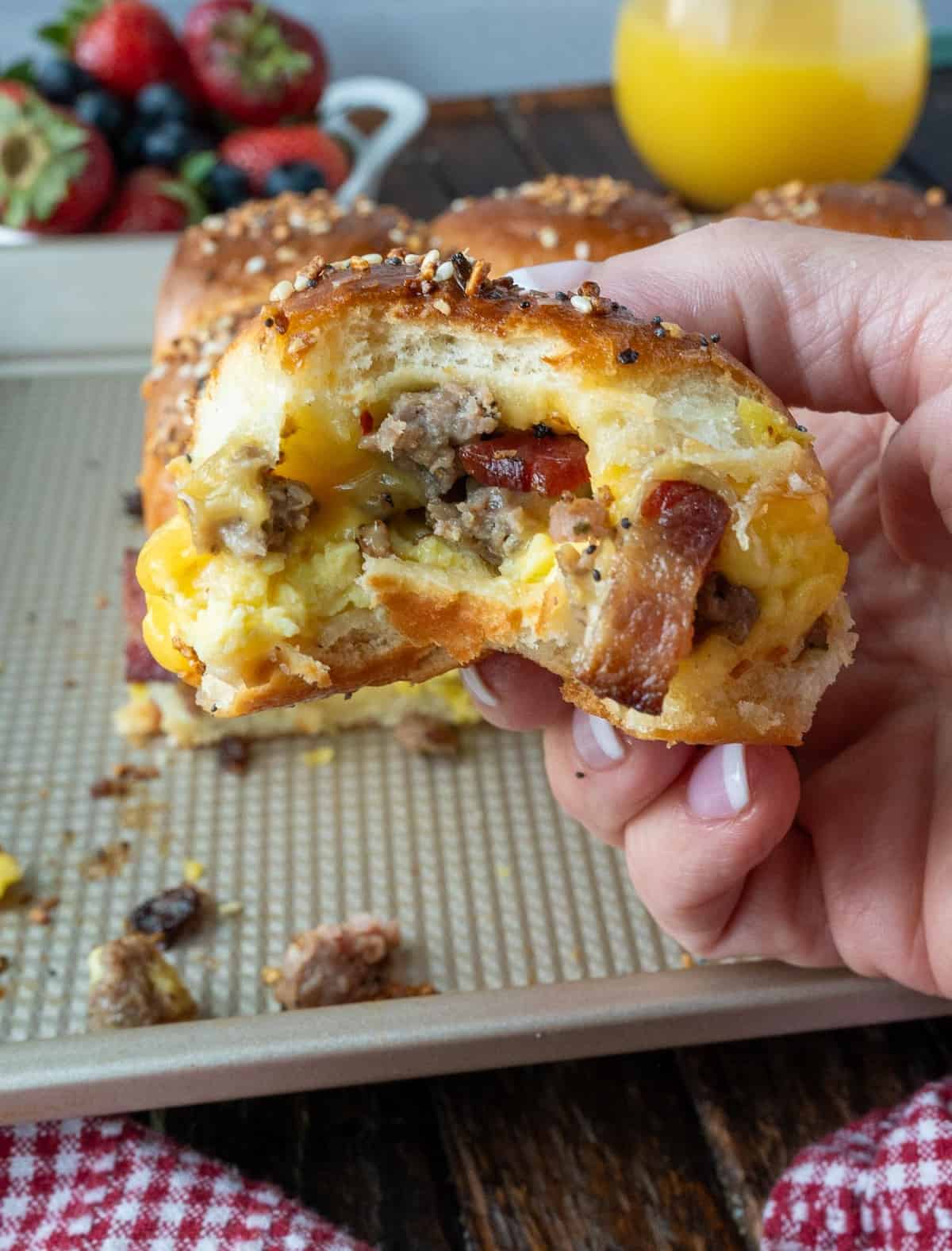 A breakfast slider with a bite out of it.