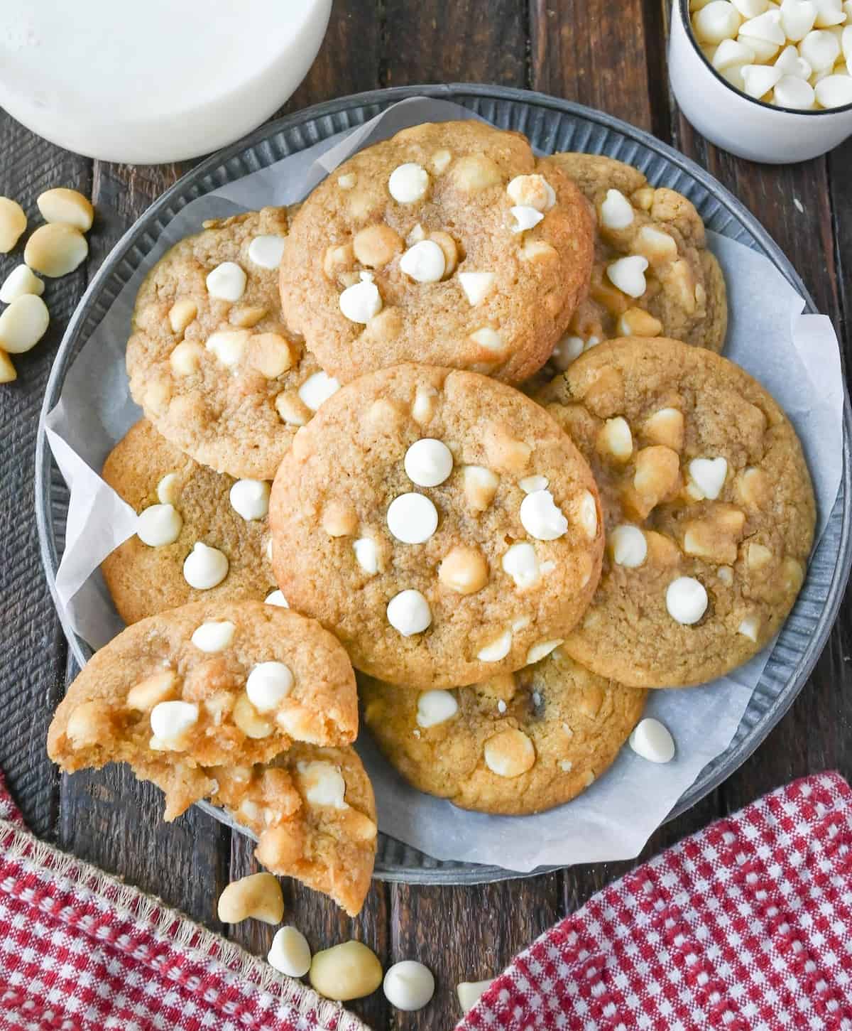 A plate of cookies, one of which is broken in half.