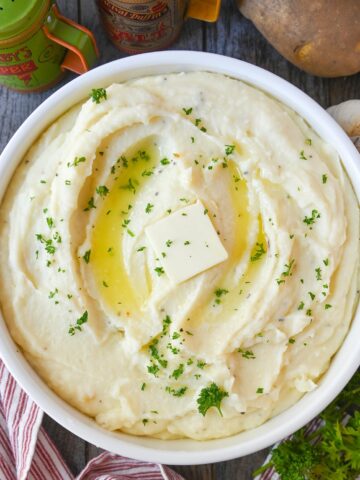 Creamy mashed potatoes in a white bowl.