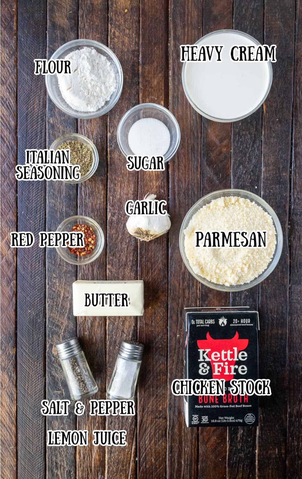 Labelled ingredients for garlic parmesan sauce on a wooden counter.