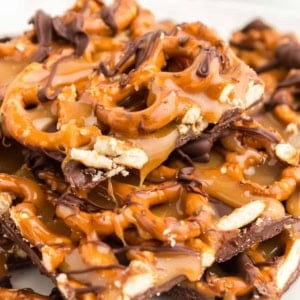 caramel pretzel bark stacked on top of each other.