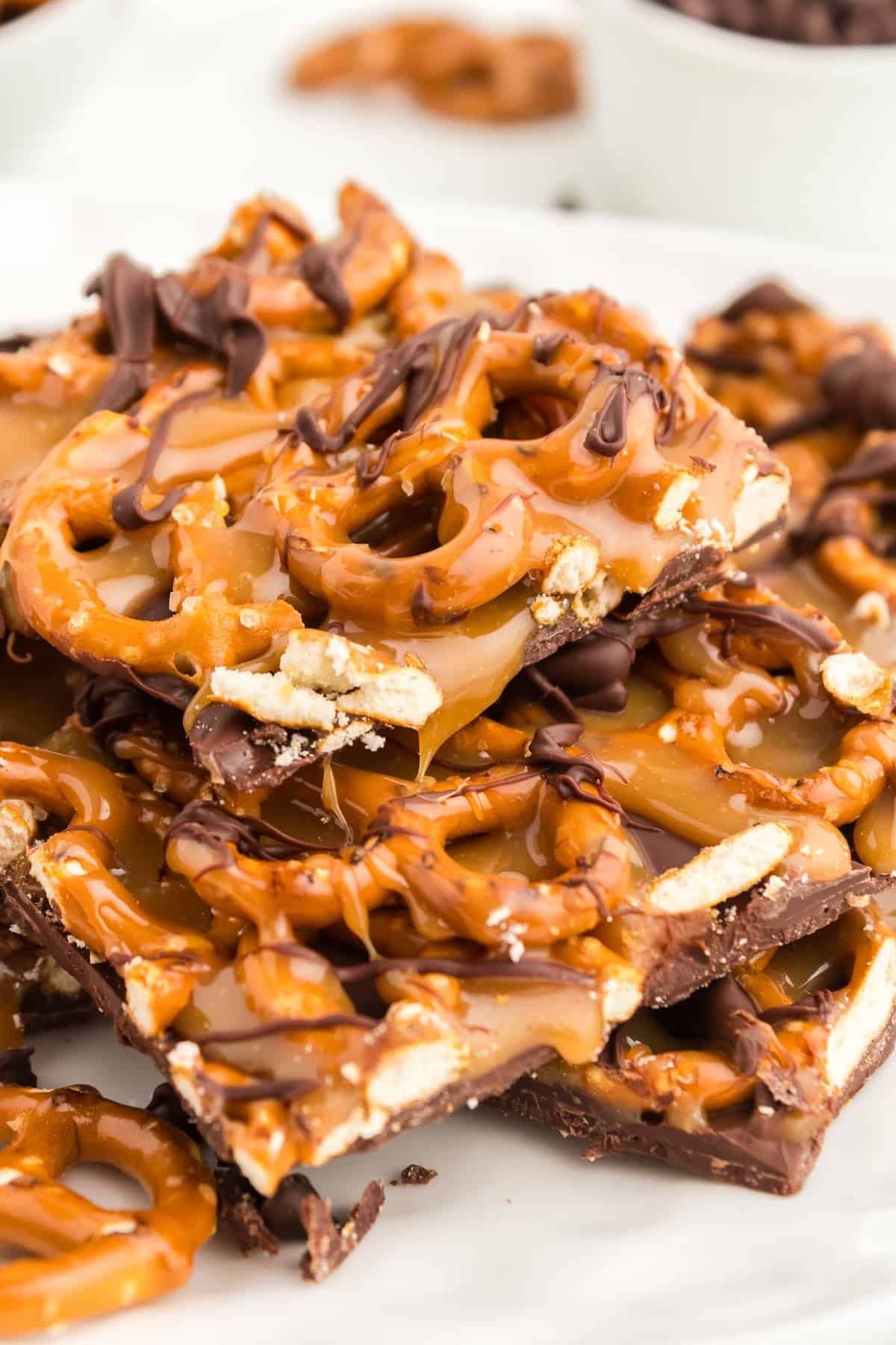 caramel pretzel bark stacked on top of each other.