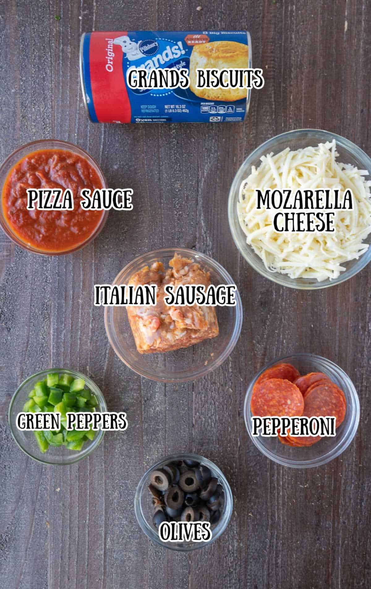 Labeled ingredients for bubble up pizza casserole.