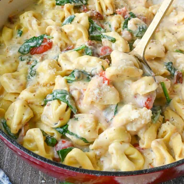 Tuscan tortellini in a red skillet.