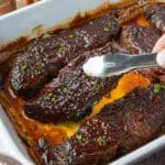 BBQ boneless beef ribs in a baking dish.
