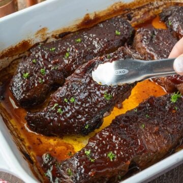 BBQ boneless beef ribs in a baking dish.