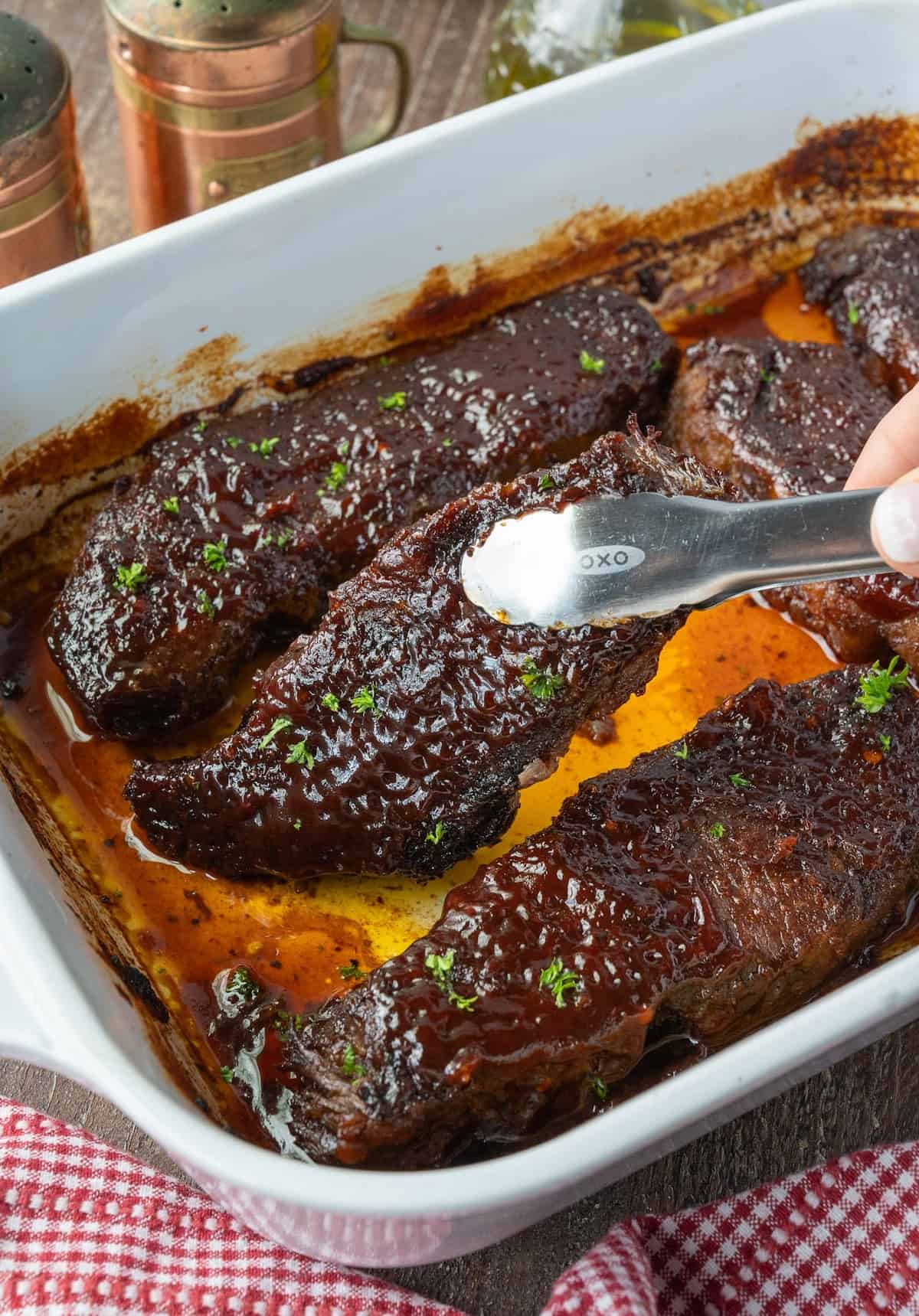 BBQ boneless beef ribs in a baking dish.