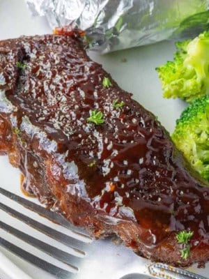 Boneless beef rib on a plate with potato and broccoli.