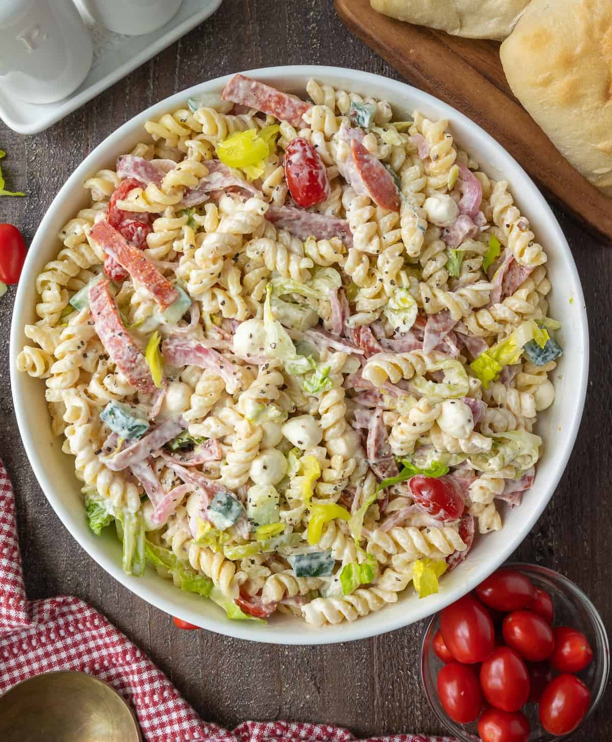 Grinder pasta salad in a white serving bowl.