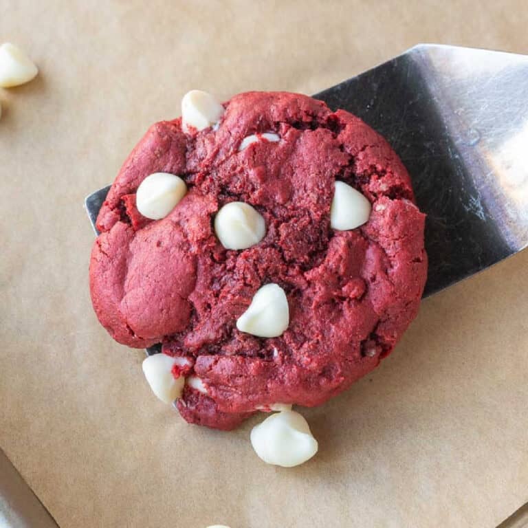 A close up of a spatula picking up a cookie.
