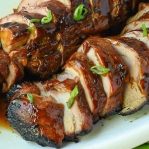 Grilled pork tenderloin on a platter.