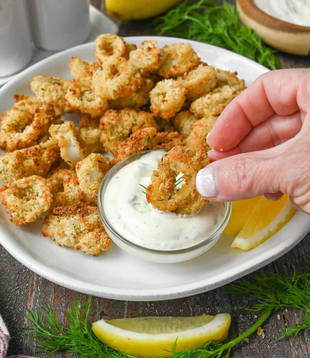 Fried calamari ring dipped in dill sauce.