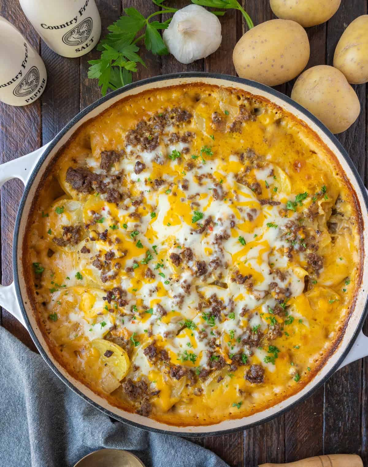 Cheesy hamburger potato casserole baked in a skillet.