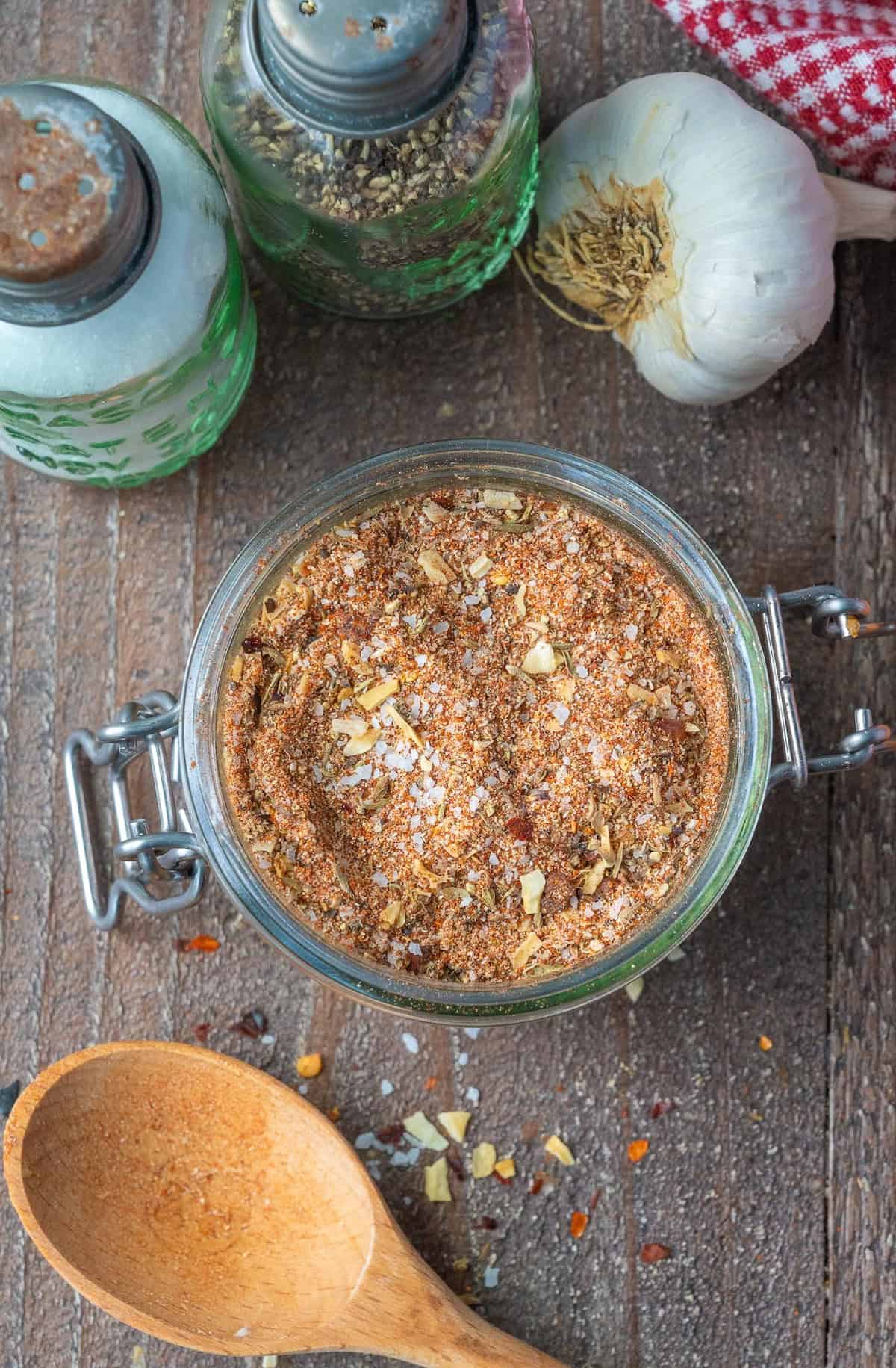 Homemade beef rub in a glass jar.