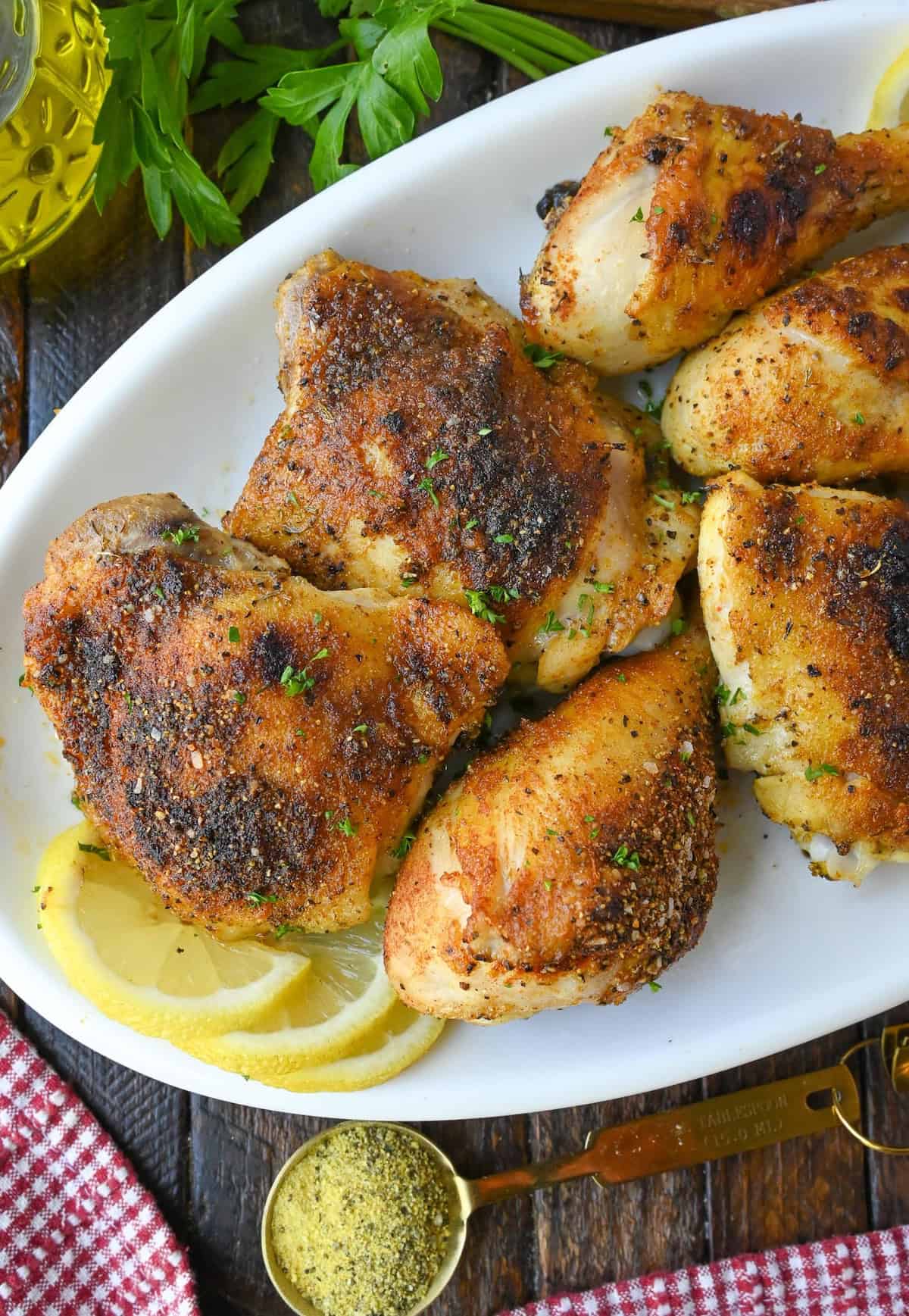 A platter of baked lemon pepper chicken.