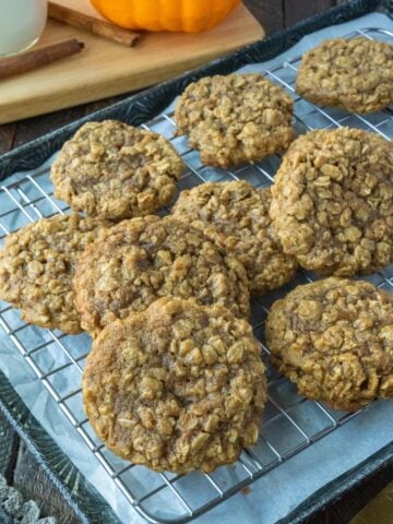 A metal cooling rack covered in pumpkin spice cookies.