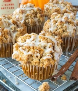 Pumpkin streusel muffins on a cooling rack.