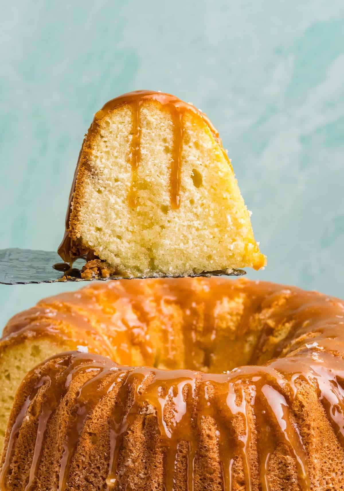 Lifting up a slice of Kentucky butter cake with a cake knife.