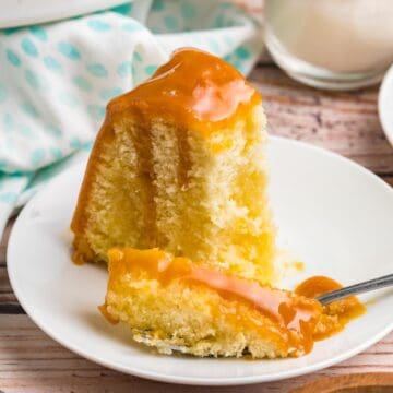 A piece of Kentucky butter cake on a plate with a fork.