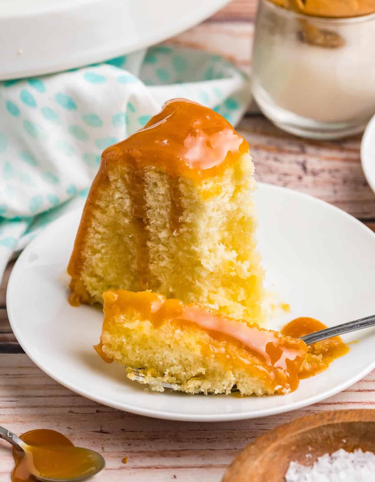 A piece of Kentucky butter cake on a plate with a fork.