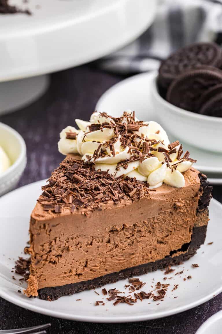 A piece of baileys cheesecake on a plate.