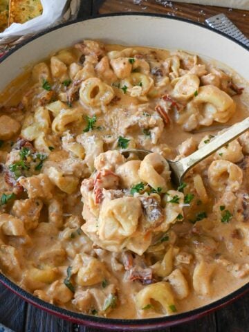 A big skillet of marry me chicken tortellini.