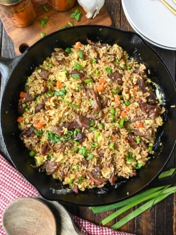 Overhead view of a skillet full of steak fried rice.