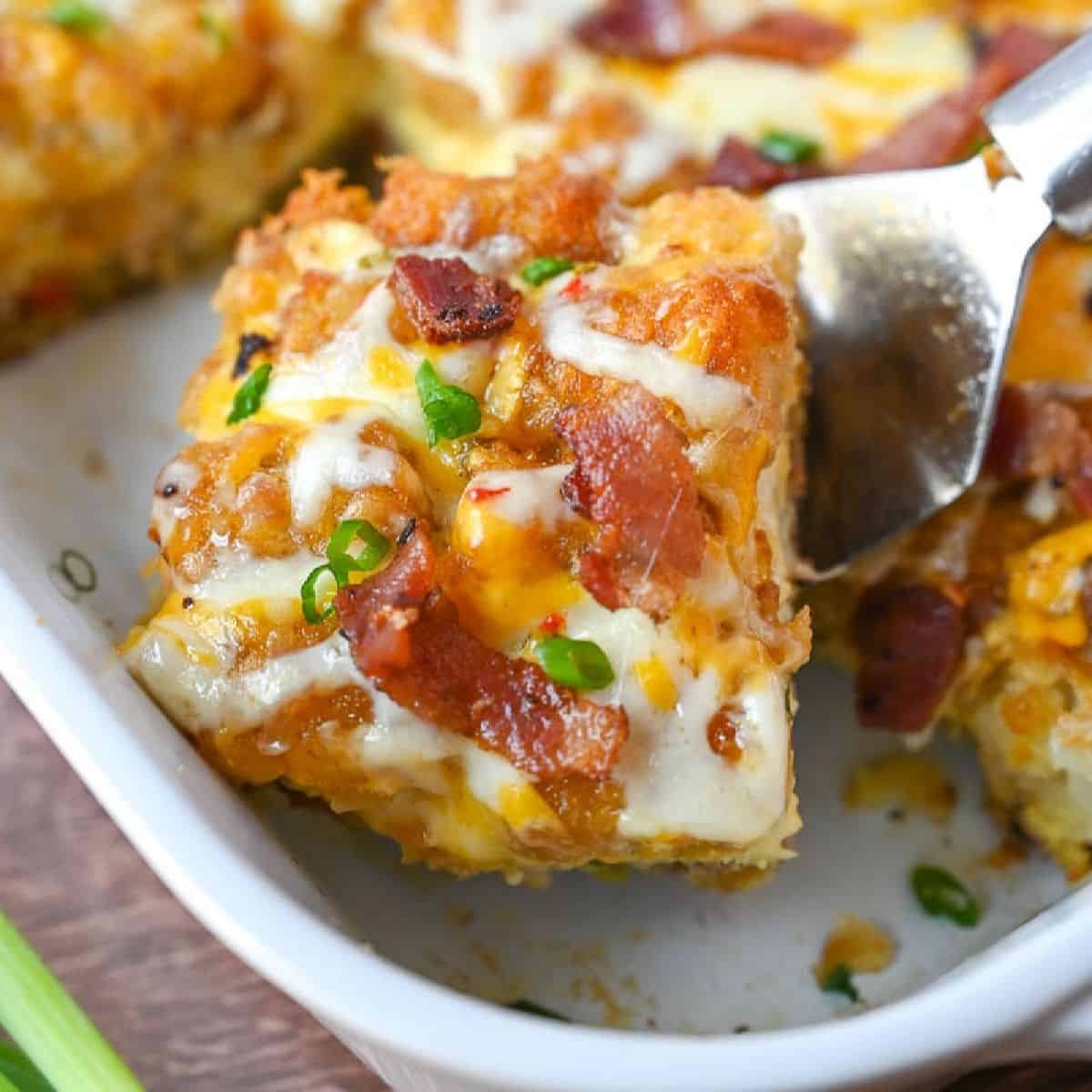 Breakfast casserole in a white baking dish.