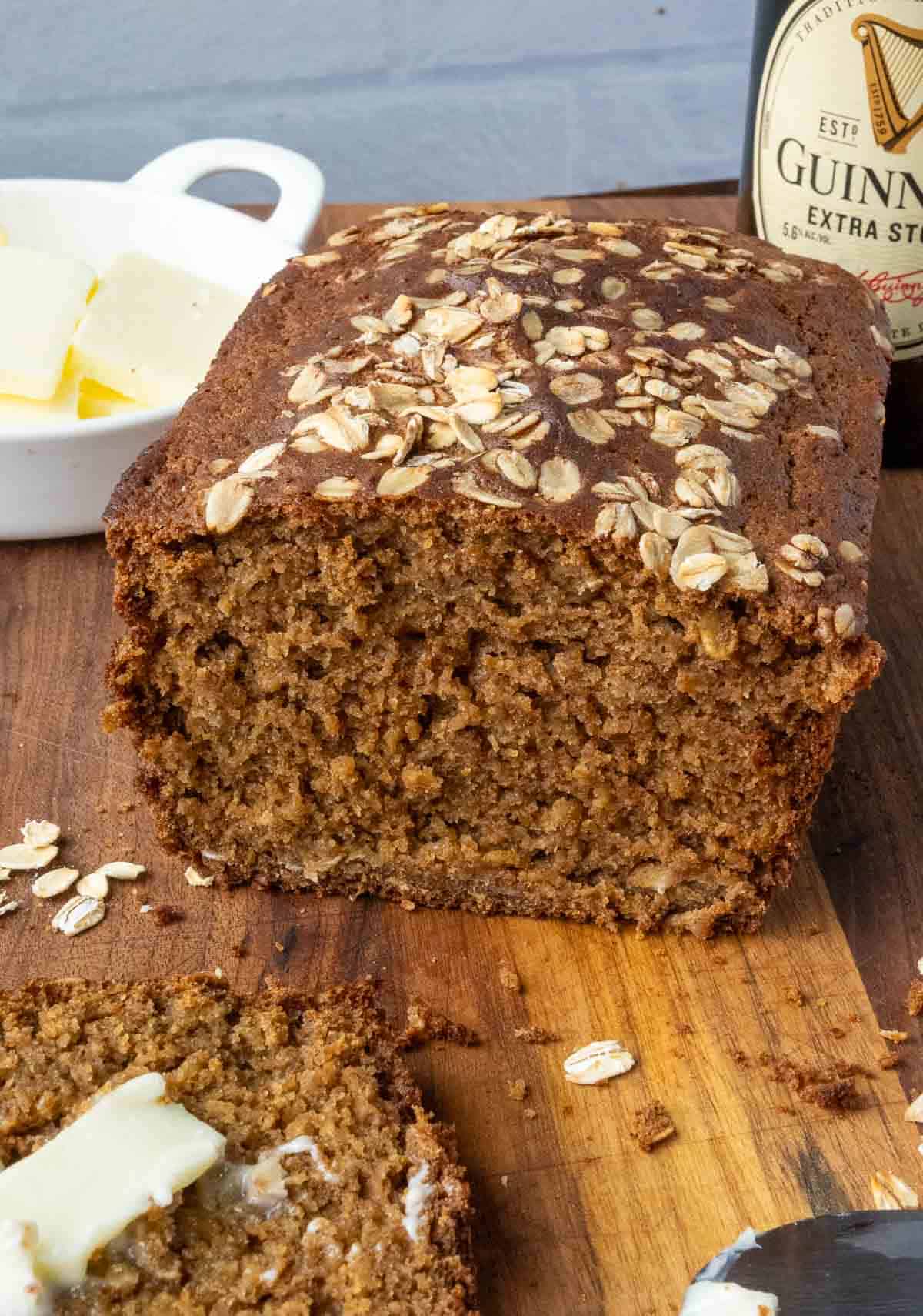 Half a loaf of irish bread on a wood counter.