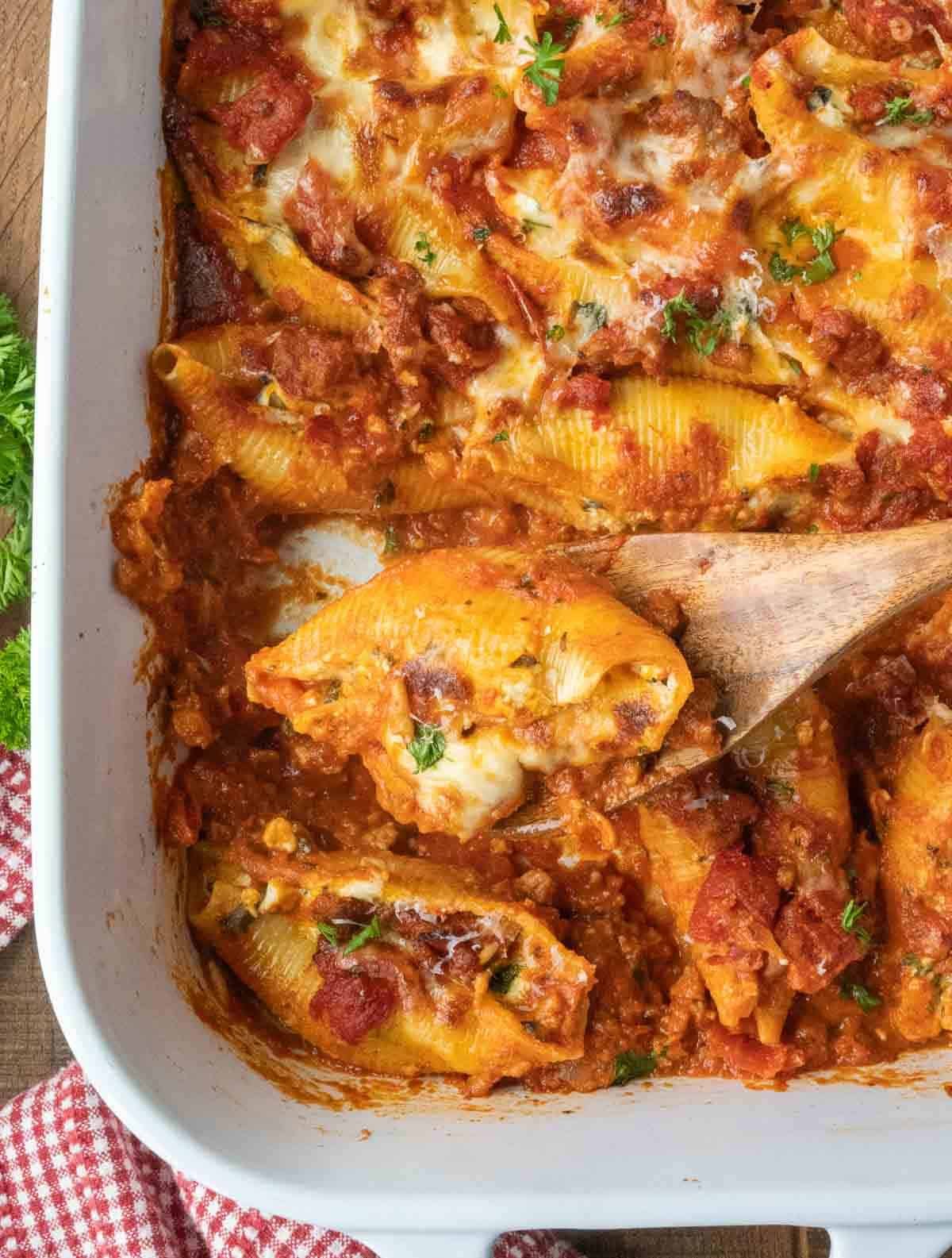 Top down view of a casserole dish filled with stuffed shells.