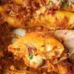 Pinterest graphic featuring cheese stuffed shells with sausage tomato cream sauce.