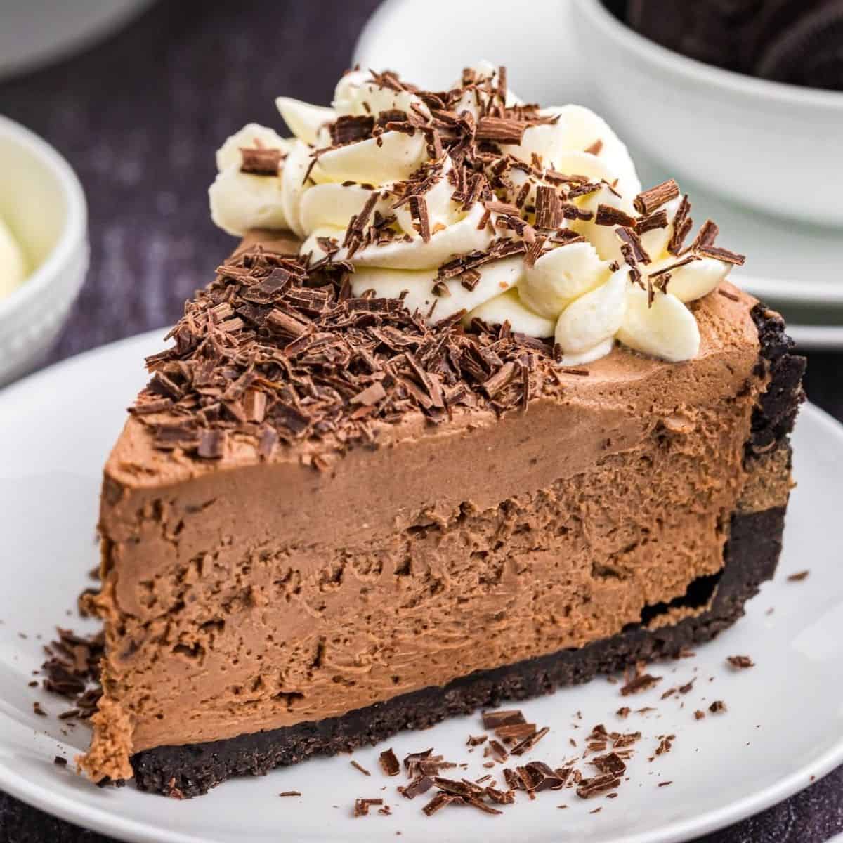 Slice of chocolate dessert on a plate.