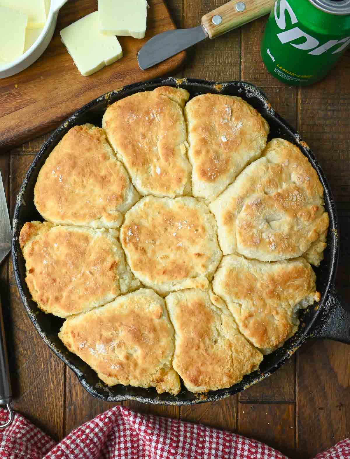 A cast iron skillet with baked 7 up biscuits.