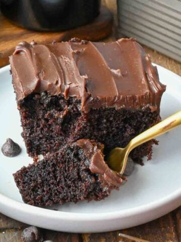 A fork picking up a bite of Baileys chocolate cake.