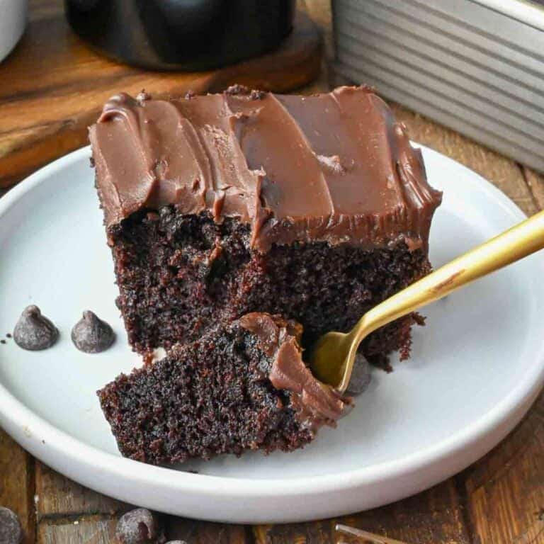 A fork picking up a bite of Baileys chocolate cake.