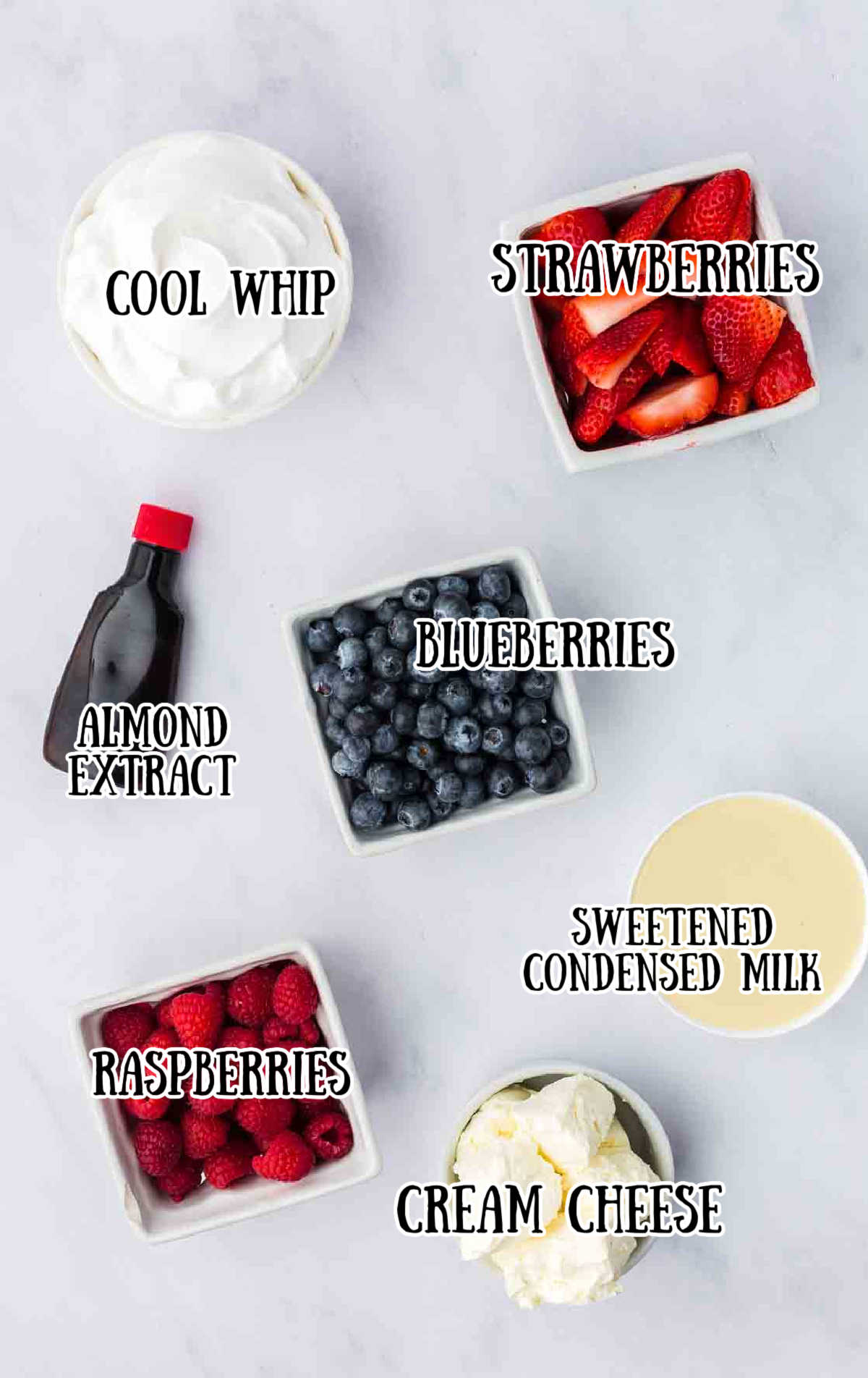 Labeled ingredients for cheesecake fruit salad.