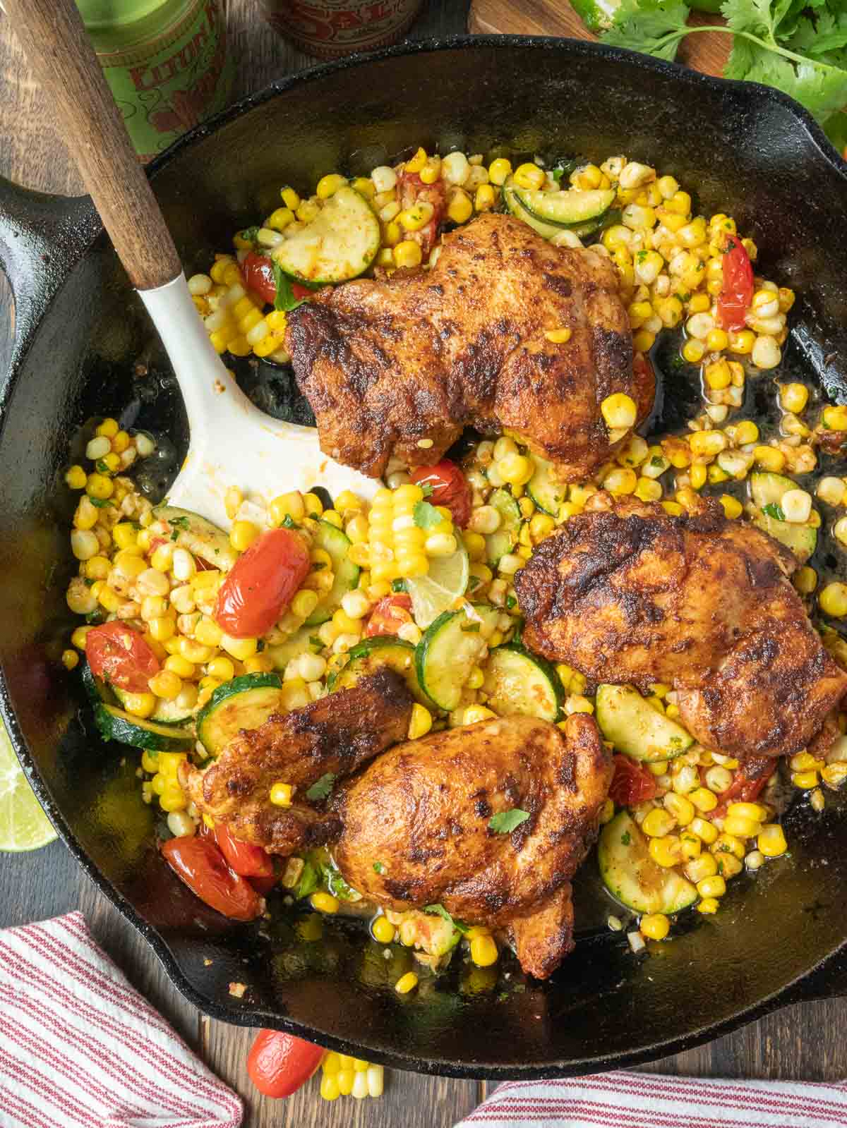 Stirring a skillet of cilantro lime chicken.