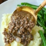 Pinterest graphic featuring ground beef and gravy over mashed potatoes.