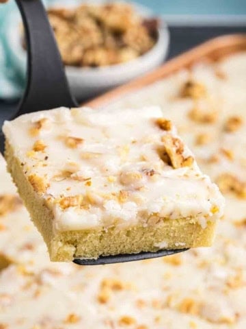Close up of a slice of sheet cake on a spatula.
