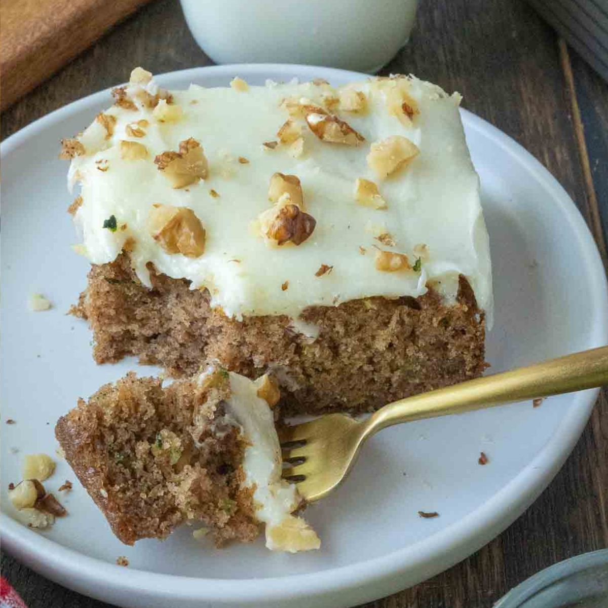 Close up of a slice of zucchini cake on a plate.