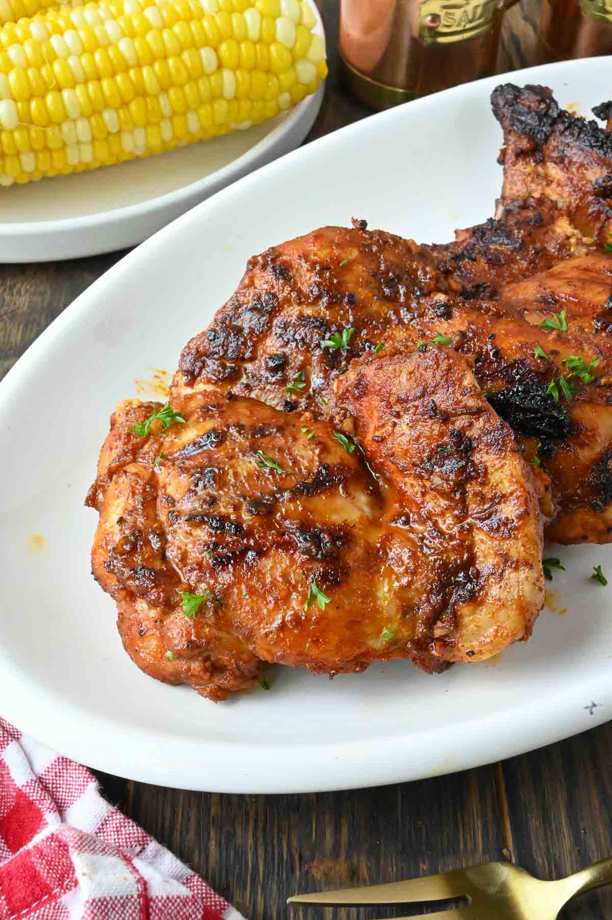 Grilled paprika chicken on plate.