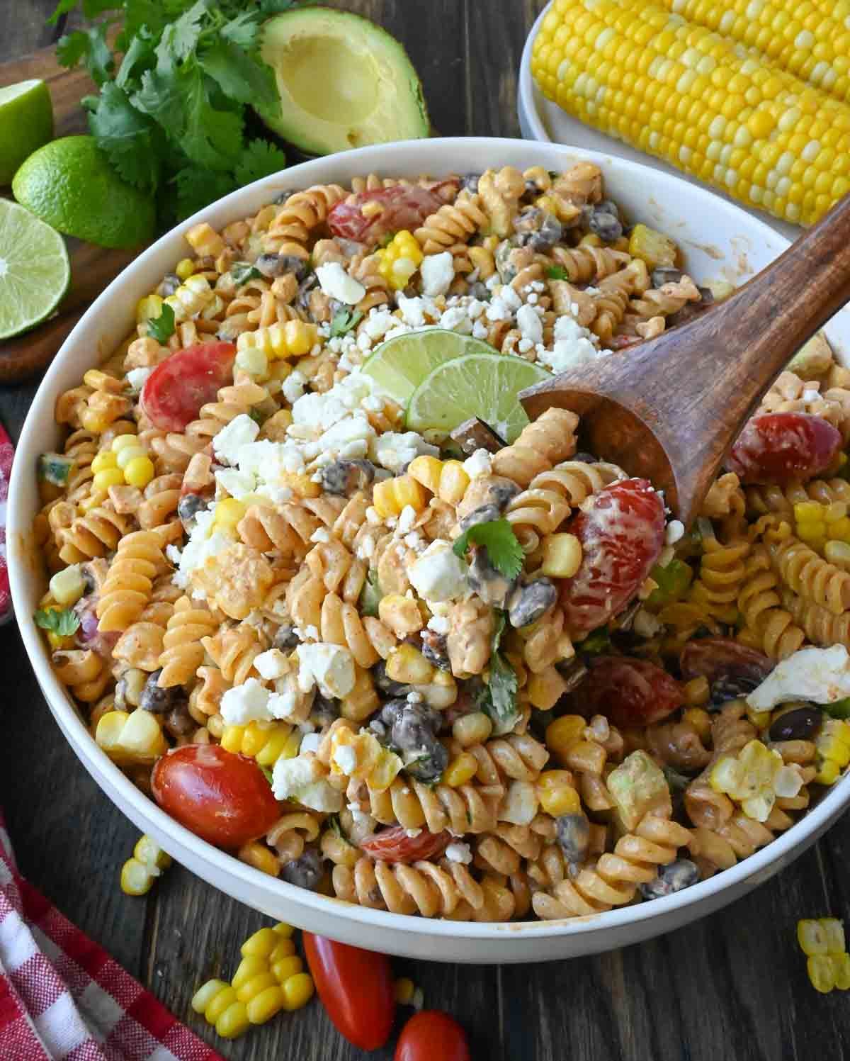 Mexican street corn pasta salad in a white bowl.