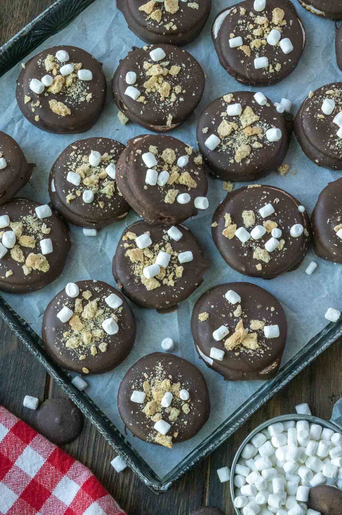 A baking sheet full of ritz smores cookies.