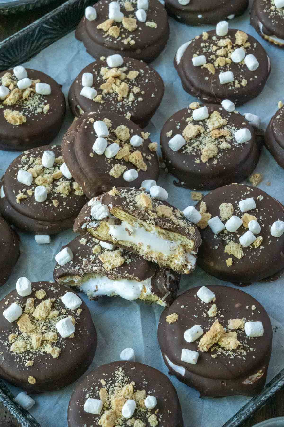 A batch of ritz smores cookies on a baking sheet.