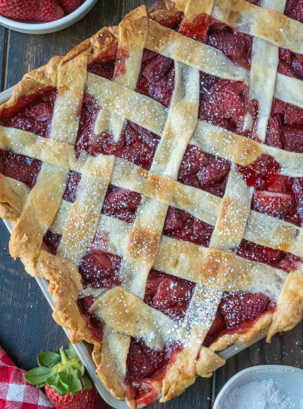 Strawberry slab pie dusted with powdered sugar.