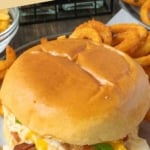 Pinterest graphic featuring a slow cooker chicken bacon ranch sandwich.