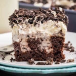 Oreo poke cake on a plate.