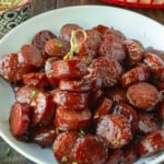 Kielbasa bites on a platter with toothpicks.