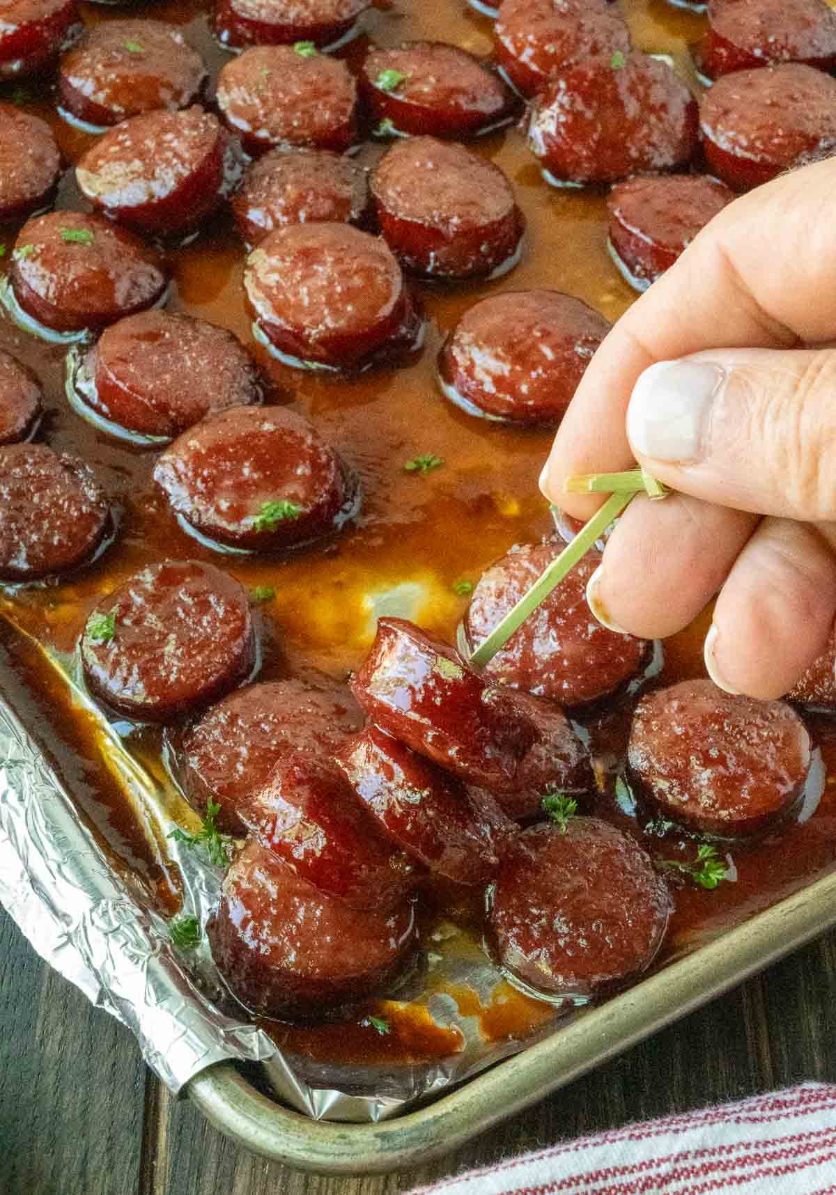 A toothpick up some kielbasa bites.